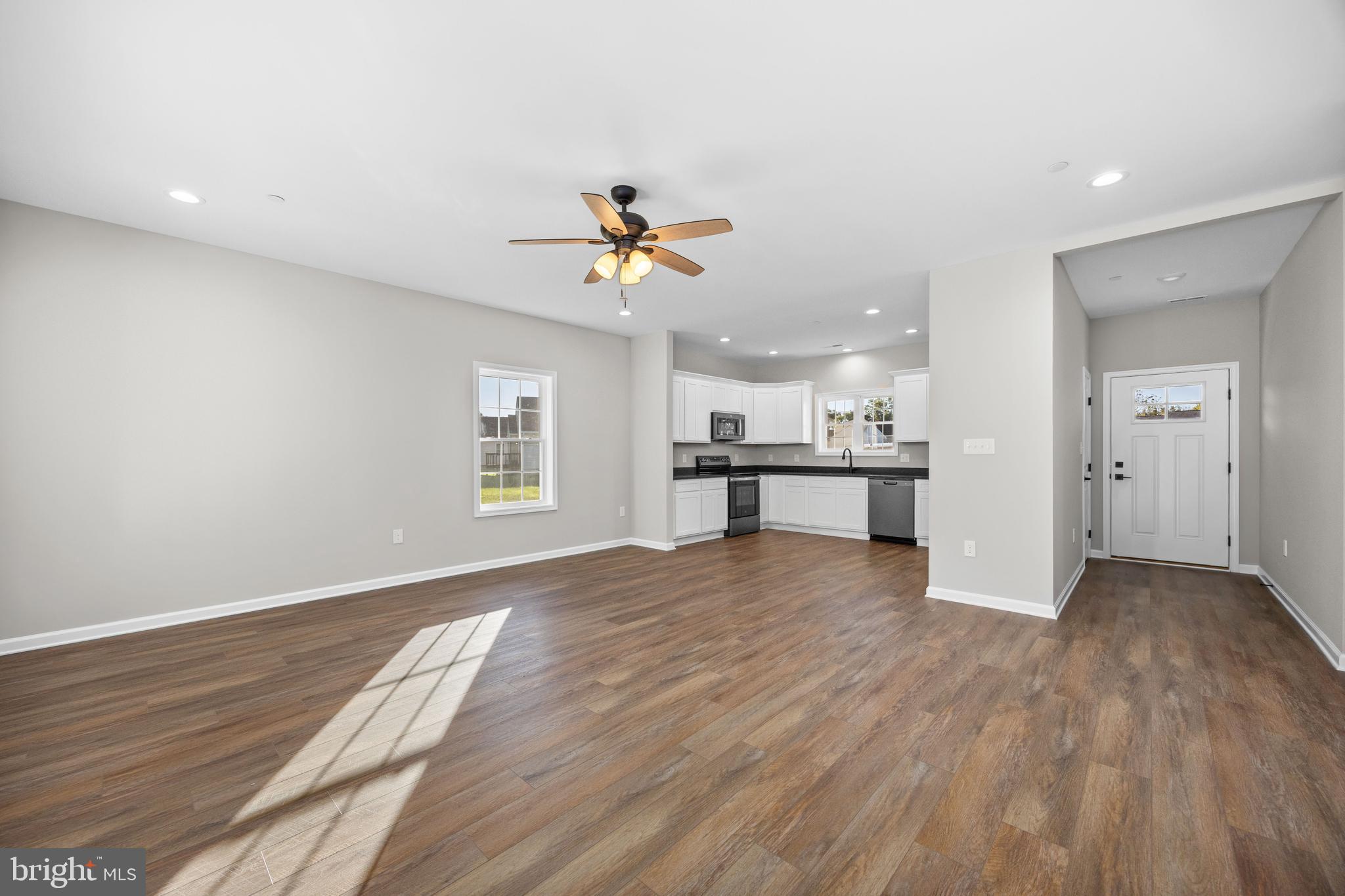 11775 St Stephens Way Princess Anne, MD 21853 - Photo 10 of 51 a view of an empty room with a kitchen and a window