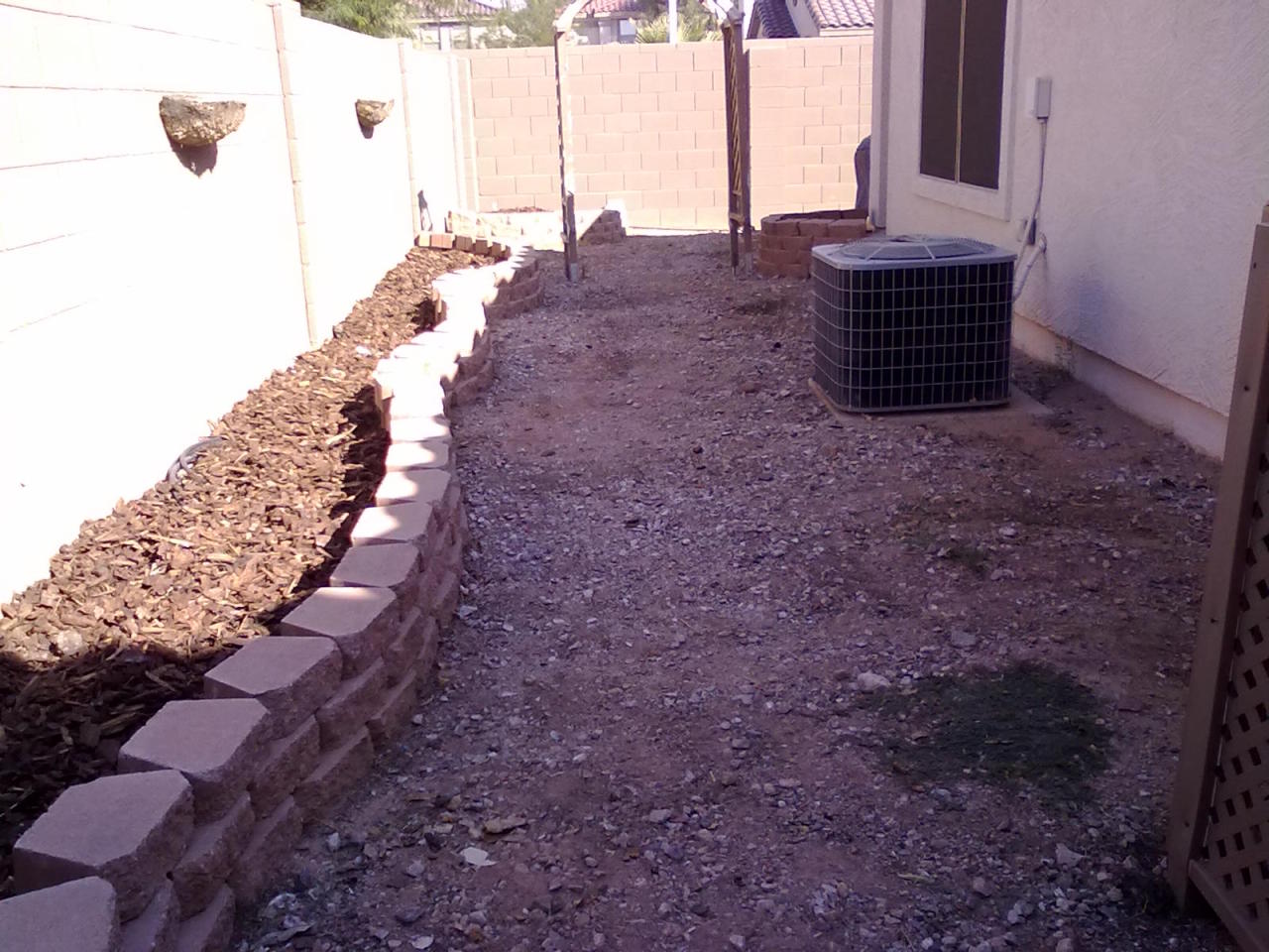 3502 South Chaparral Road Apache Junction, AZ 85119 - Photo 7 of 16 Backyard with raised flowerbed & archway