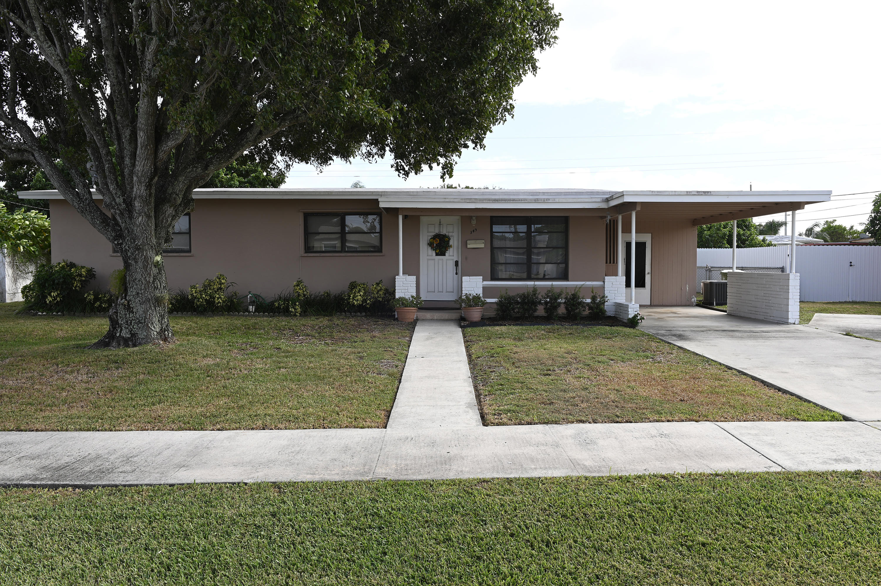 349 Pinehurst Road Palm Springs, FL 33461 - Photo 1 of 9 Front
