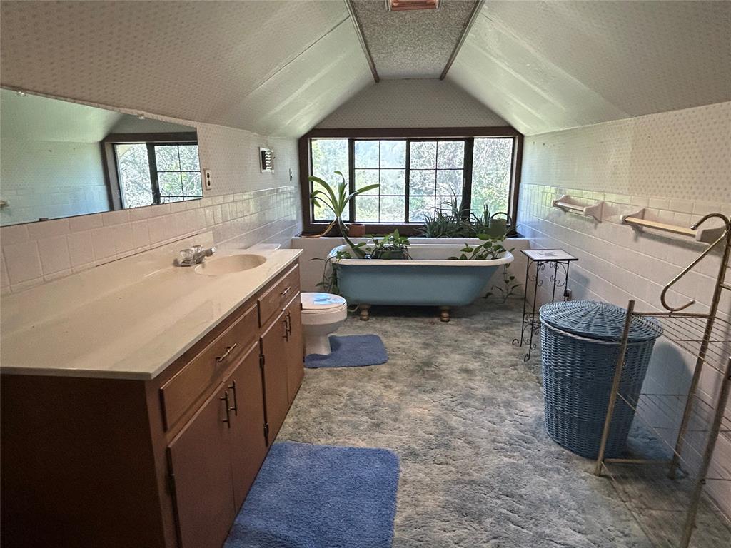 341 West Fm 574 Goldthwaite, TX 76844 - Photo 30 of 40 a large bathroom with a bathtub sink and toilet