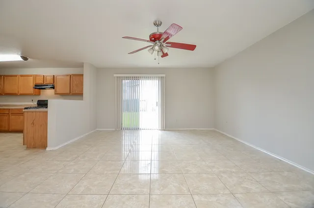 a view of a kitchen with a sink and a chandelier