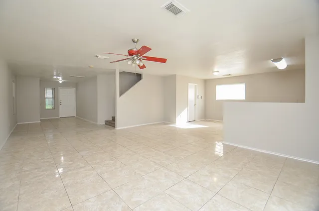 a view of a kitchen with a sink and a chandelier