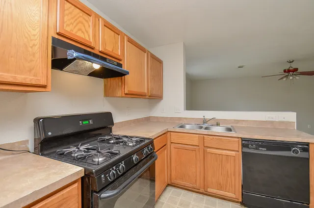 a kitchen with a stove and a sink