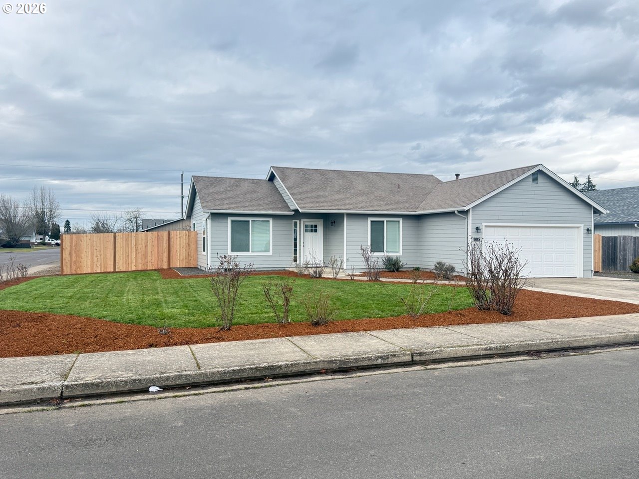 905 Monroe Street Harrisburg, OR 97446 - Photo 1 of 31 front view of a house with a yard