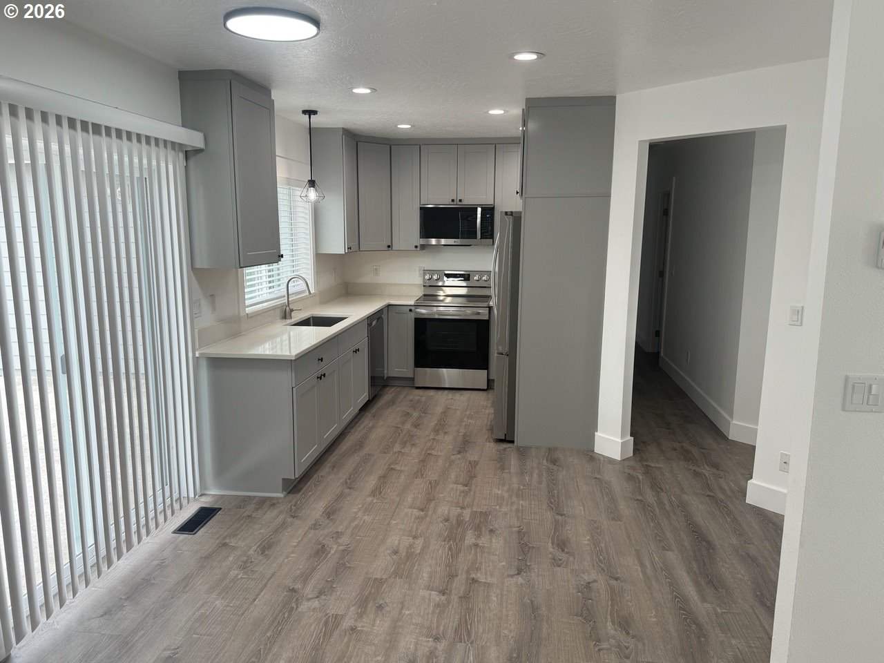 905 Monroe Street Harrisburg, OR 97446 - Photo 12 of 31 a kitchen with stainless steel appliances granite countertop a refrigerator and a sink