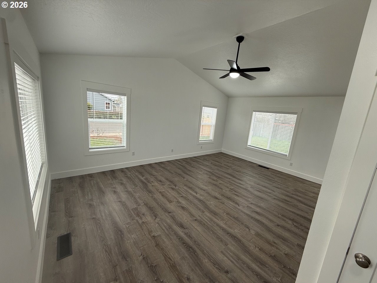 905 Monroe Street Harrisburg, OR 97446 - Photo 13 of 31 a view of an empty room with a window