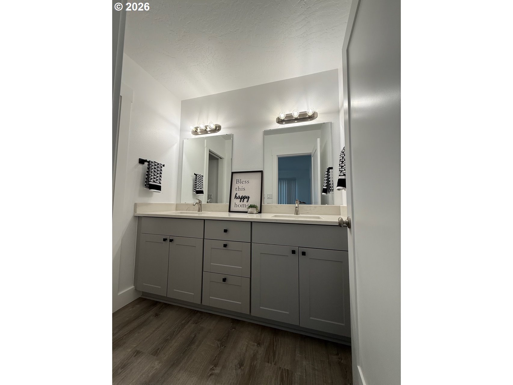 905 Monroe Street Harrisburg, OR 97446 - Photo 17 of 31 a spacious bathroom with a double vanity sink and mirror