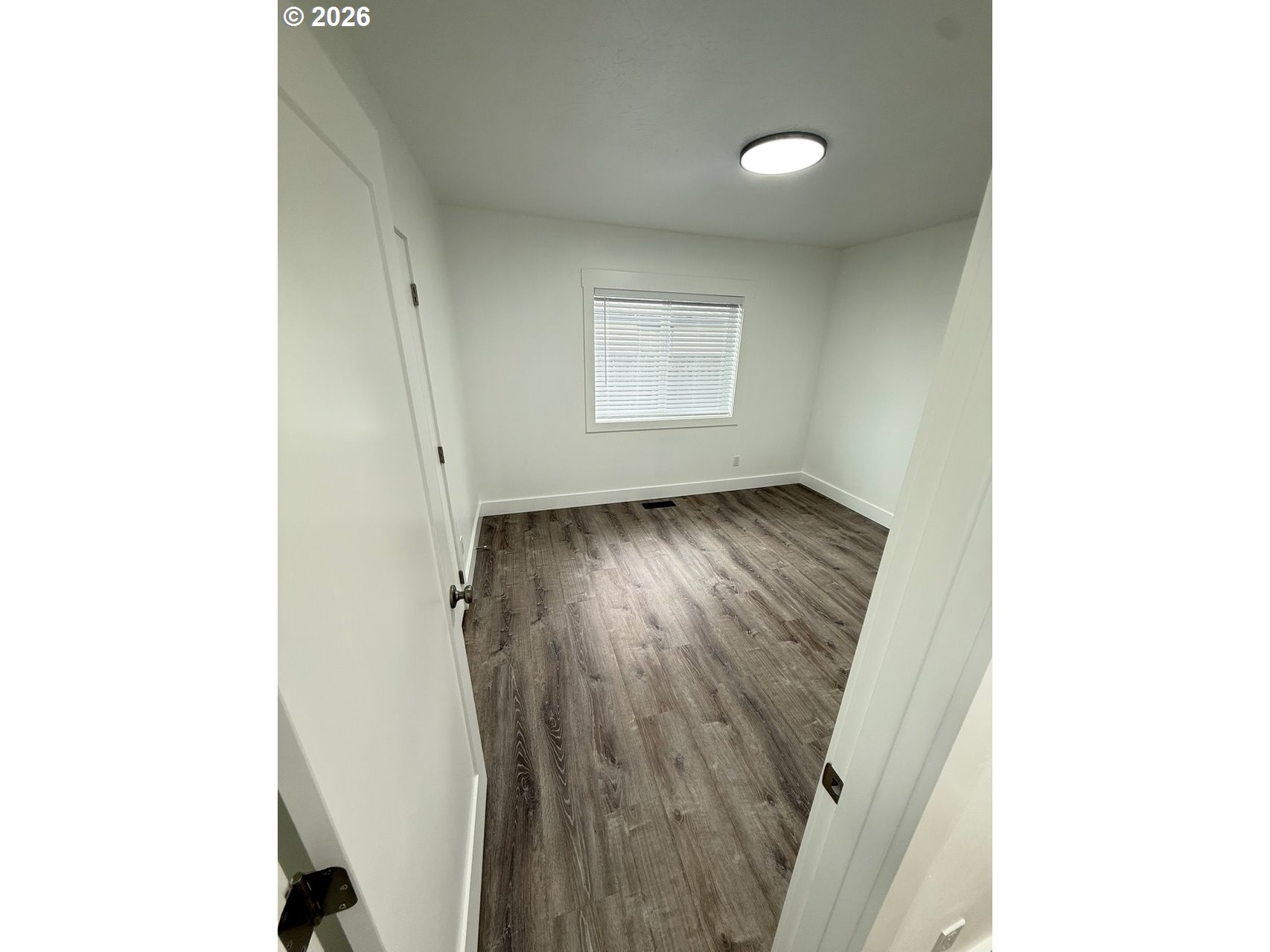 905 Monroe Street Harrisburg, OR 97446 - Photo 21 of 31 a view of a hallway with wooden floor