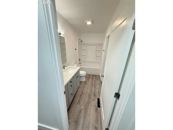 a bathroom with a sink and a shower