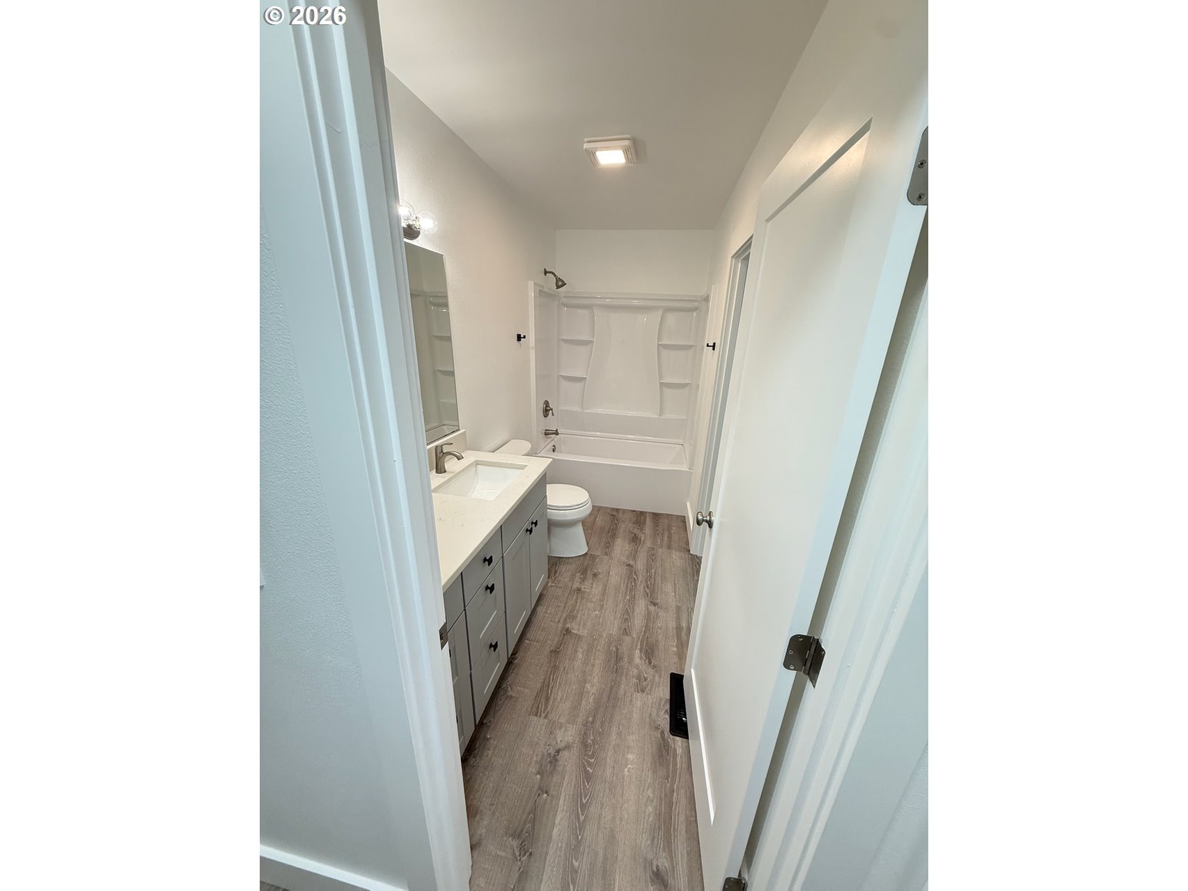 905 Monroe Street Harrisburg, OR 97446 - Photo 22 of 31 a bathroom with a sink and a shower