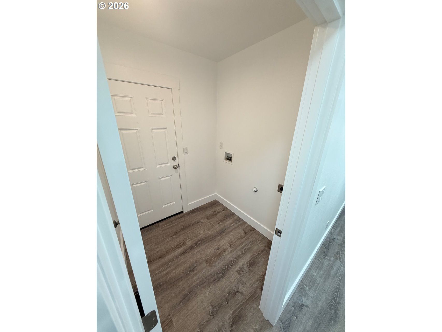 905 Monroe Street Harrisburg, OR 97446 - Photo 27 of 31 a view of a hallway with wooden floor