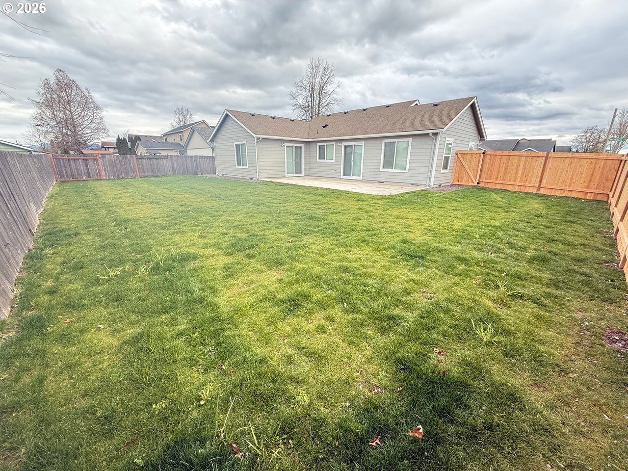 905 Monroe Street Harrisburg, OR 97446 - Photo 29 of 31 a view of a house with a yard and plants