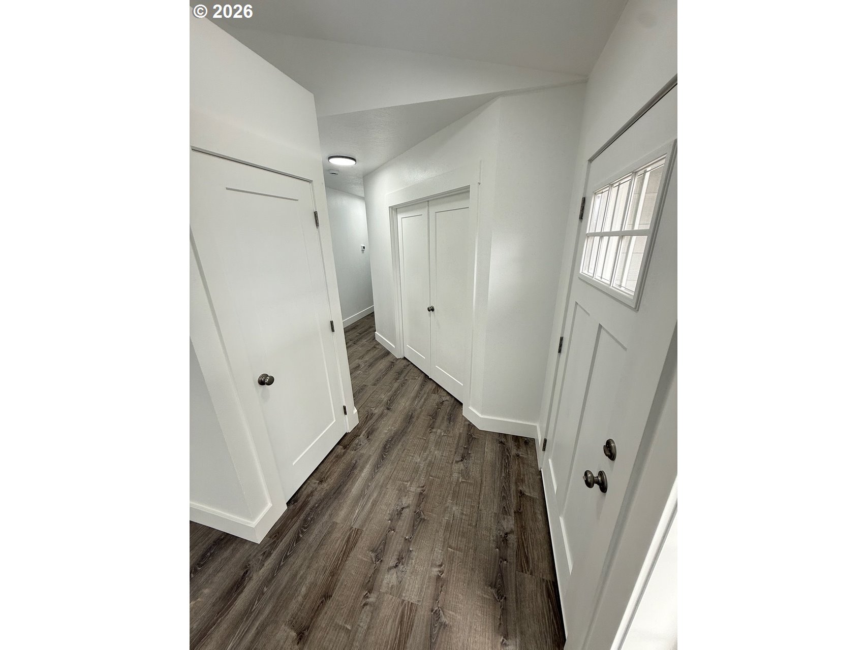905 Monroe Street Harrisburg, OR 97446 - Photo 5 of 31 a view of a hallway with wooden floor and staircase