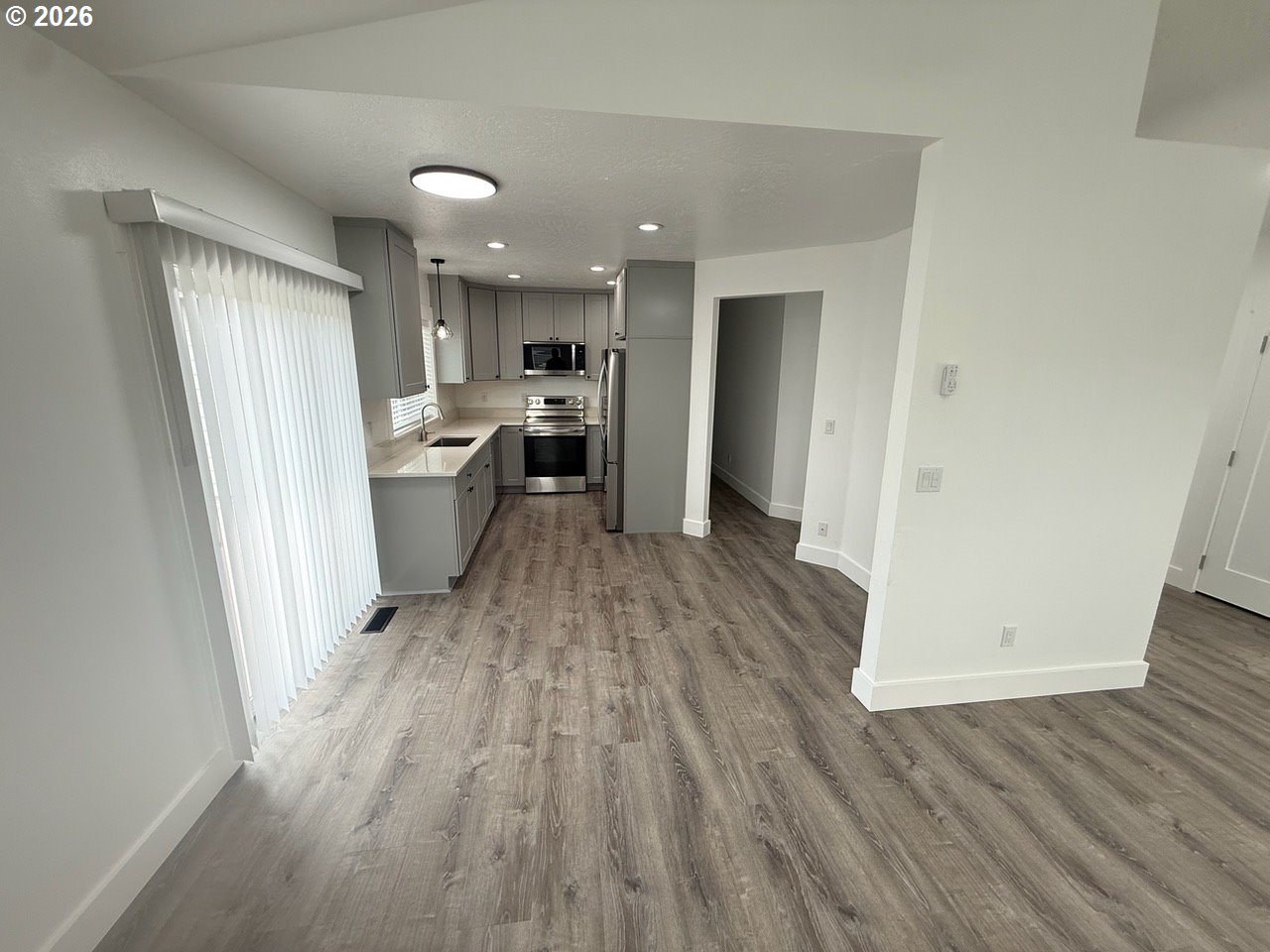905 Monroe Street Harrisburg, OR 97446 - Photo 9 of 31 a view of a kitchen from a hallway