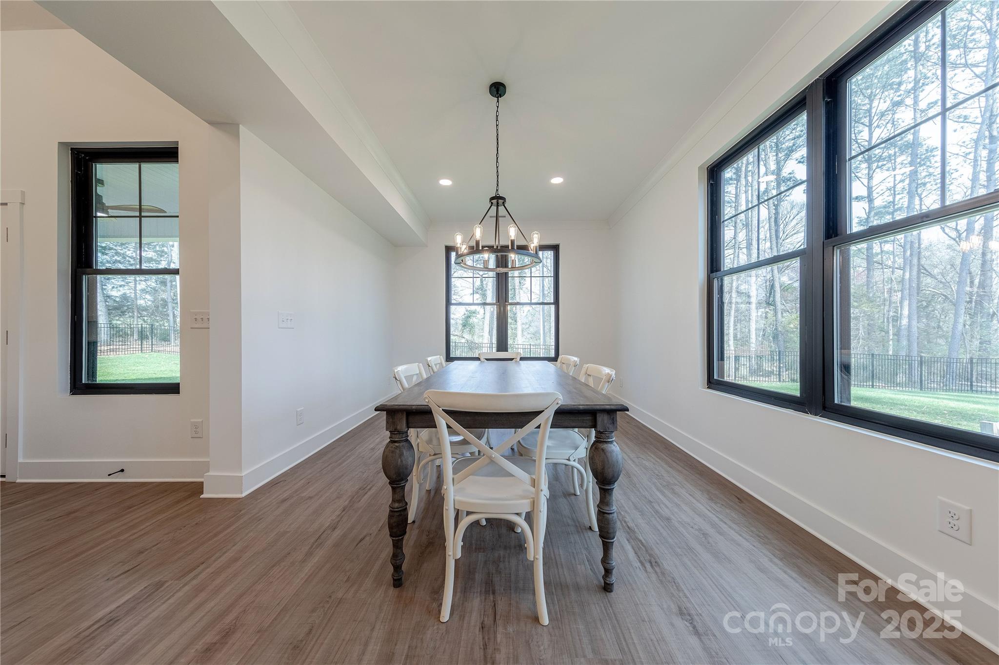 13625 Buster Road Stanfield, NC 28163 - Photo 15 of 43 a view of a dining room with furniture window and wooden floor