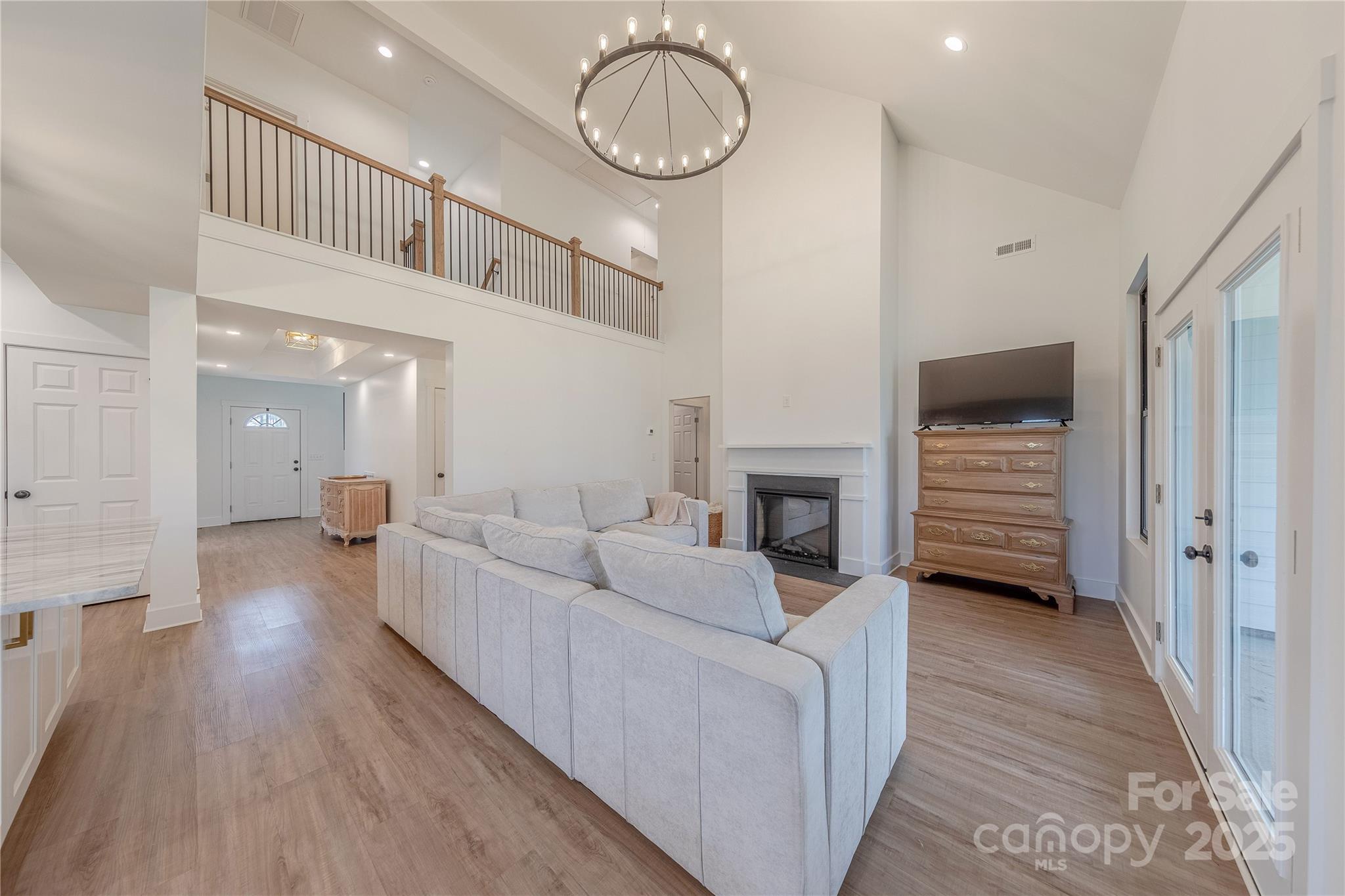13625 Buster Road Stanfield, NC 28163 - Photo 16 of 43 a living room with furniture and a wooden floor