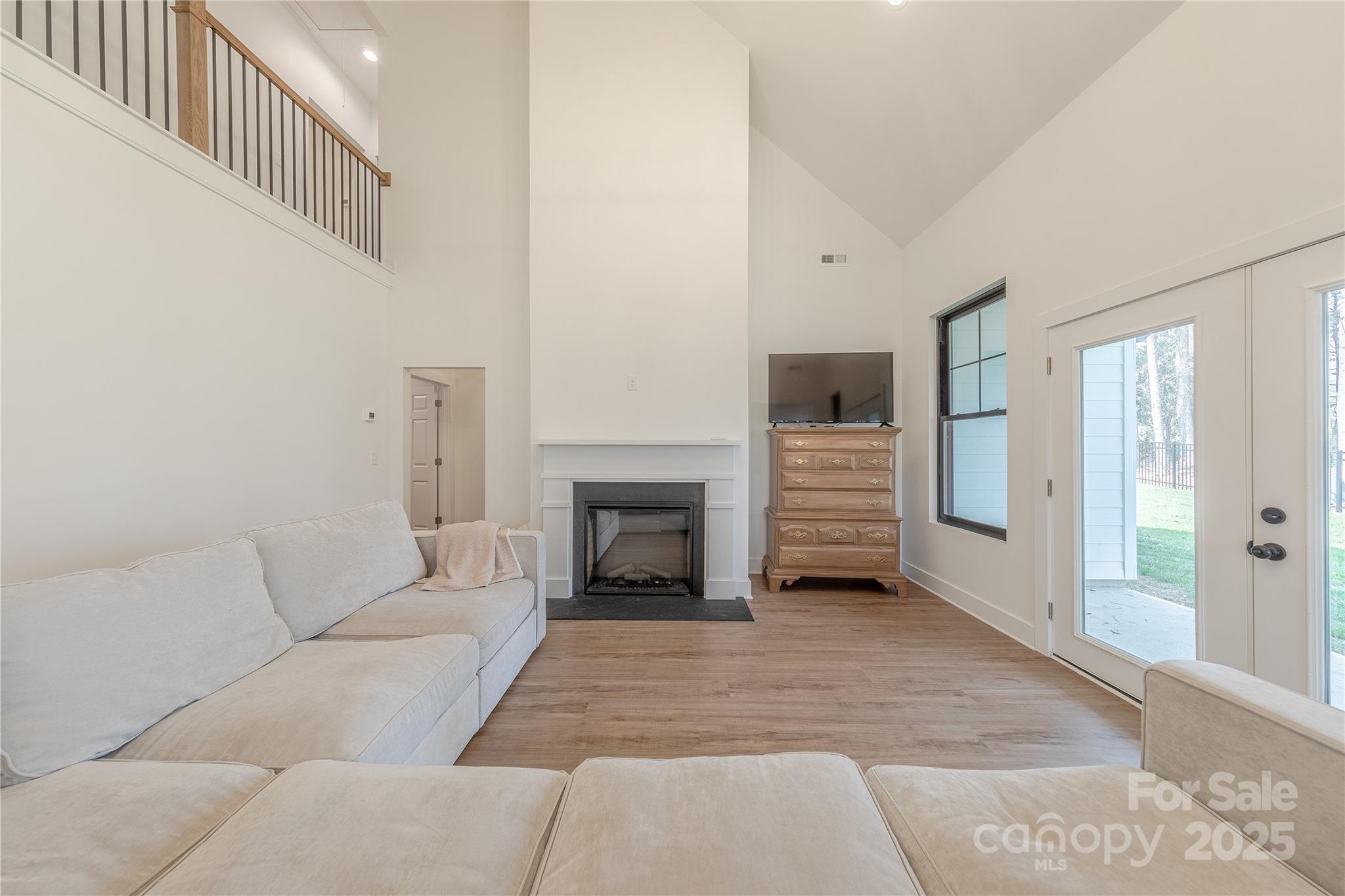 13625 Buster Road Stanfield, NC 28163 - Photo 17 of 43 a living room with furniture and a fireplace