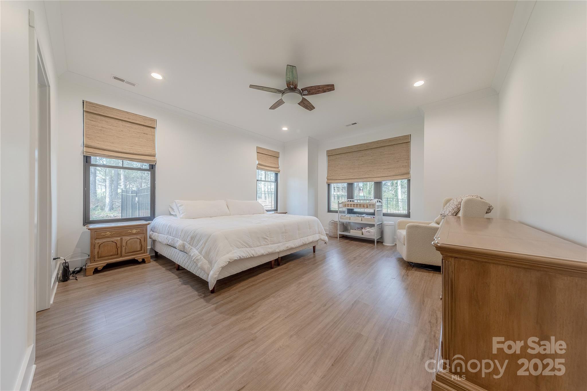13625 Buster Road Stanfield, NC 28163 - Photo 19 of 43 a bedroom with a bed couch and a window
