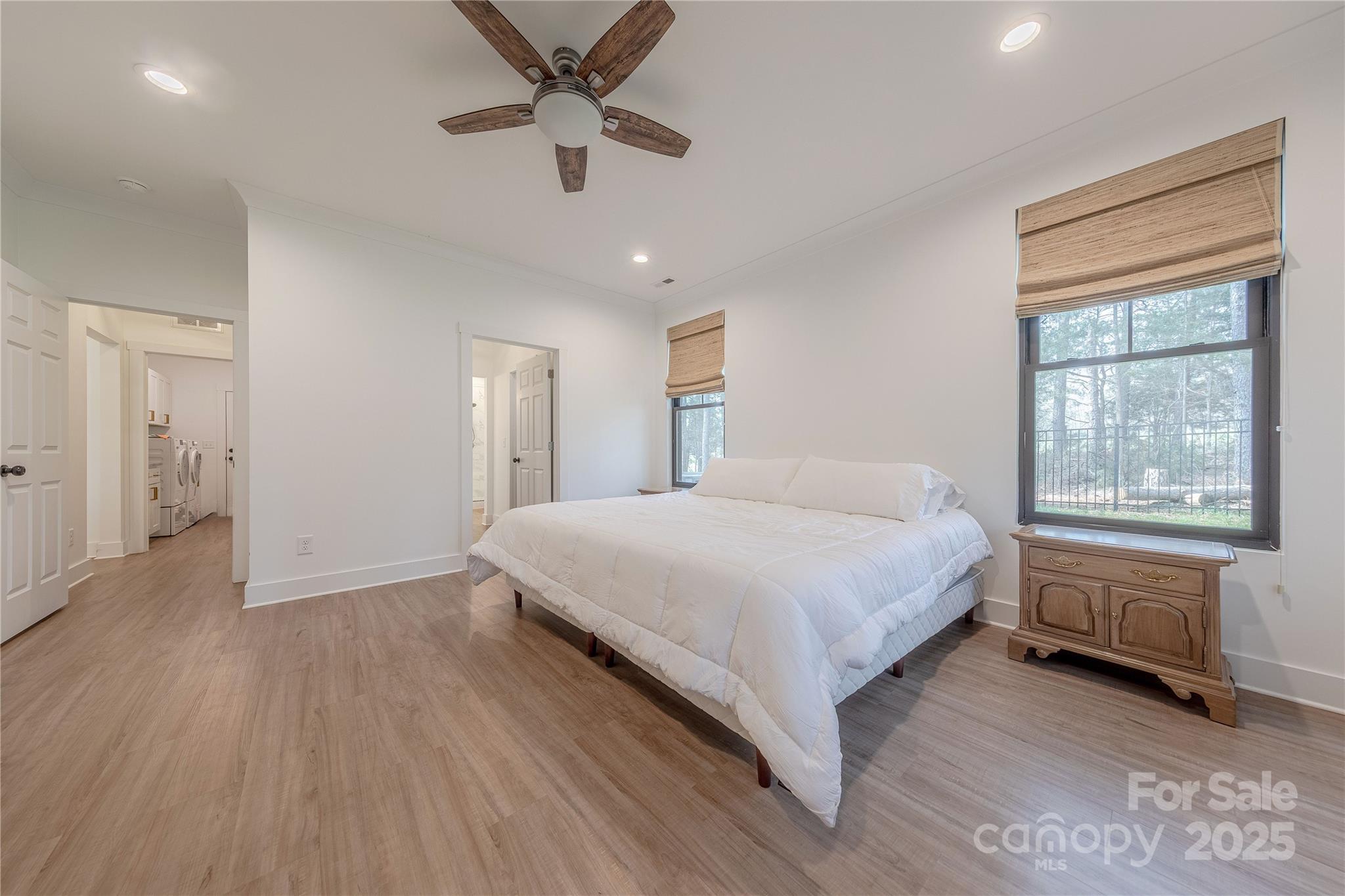 13625 Buster Road Stanfield, NC 28163 - Photo 20 of 43 a spacious bedroom with a bed and a window