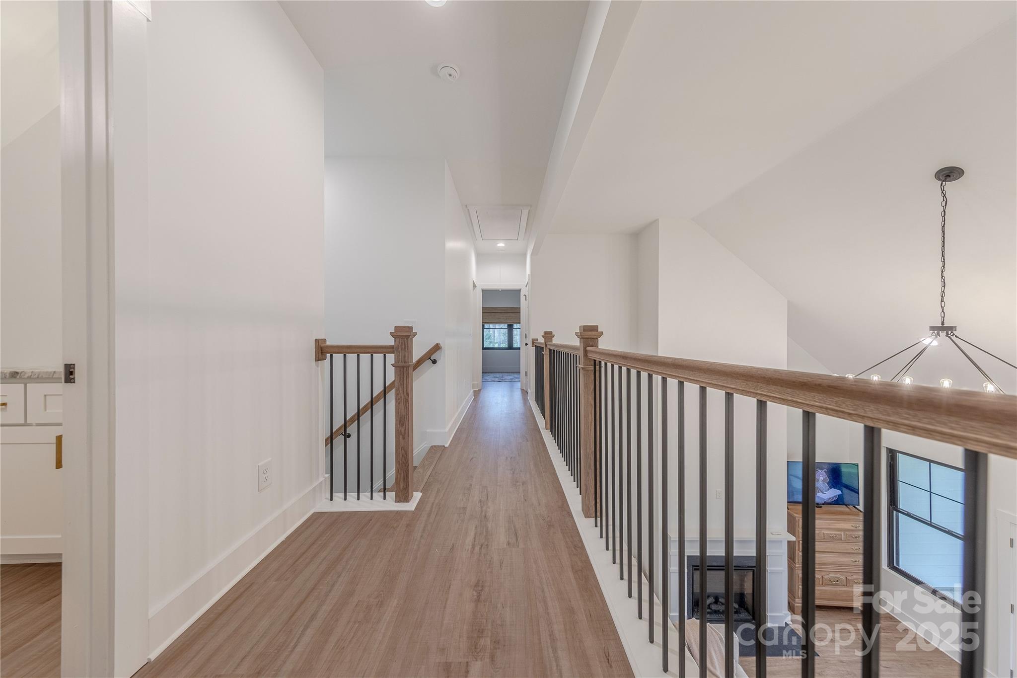 13625 Buster Road Stanfield, NC 28163 - Photo 26 of 43 a view of a hallway with wooden floor