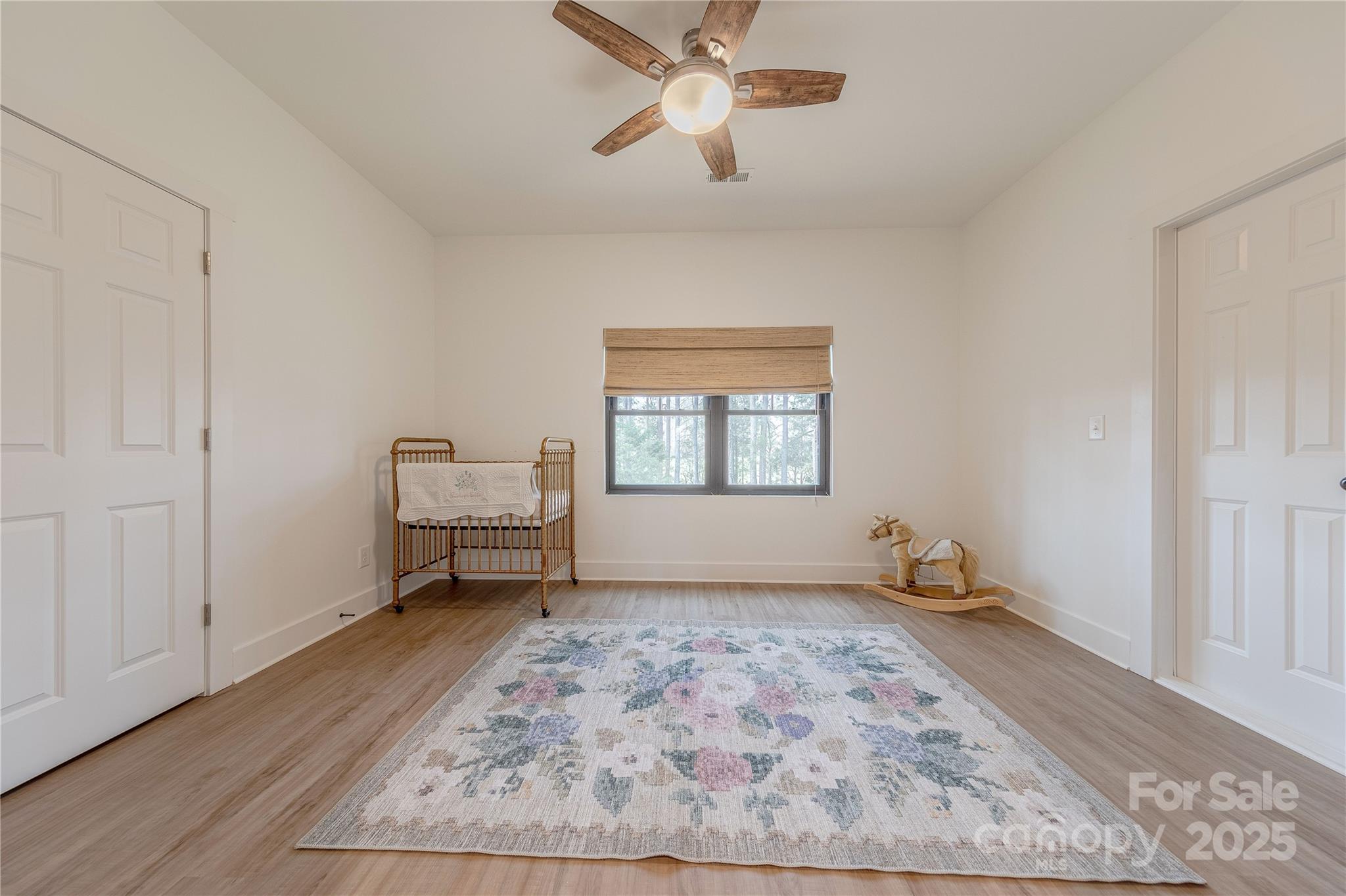 13625 Buster Road Stanfield, NC 28163 - Photo 27 of 43 wooden floor in an empty room with a window