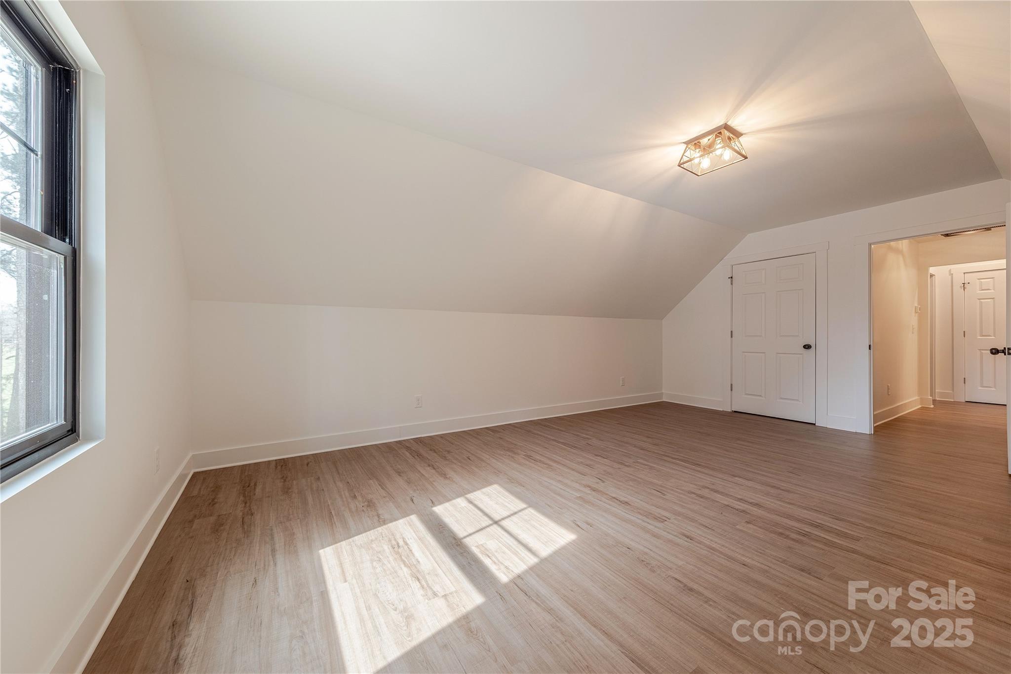 13625 Buster Road Stanfield, NC 28163 - Photo 33 of 43 wooden floor in an empty room with a window