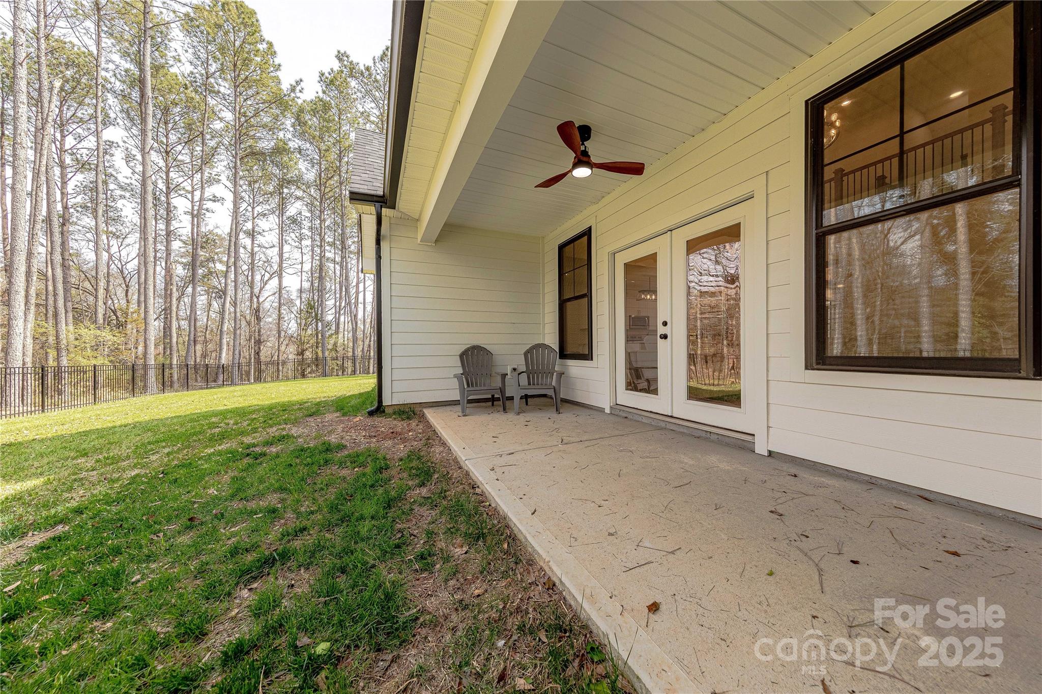 13625 Buster Road Stanfield, NC 28163 - Photo 39 of 43 a view of a porch with hardwood floor and front door