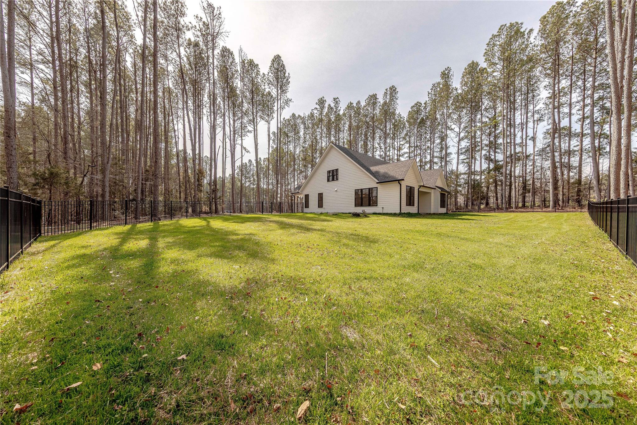 13625 Buster Road Stanfield, NC 28163 - Photo 42 of 43 a view of a house with a big yard and large trees