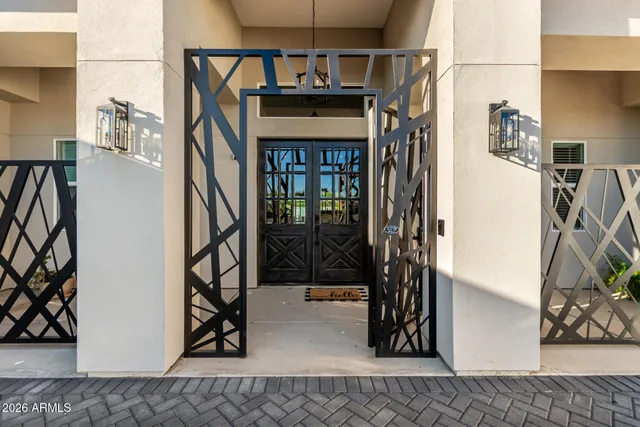 a living room with furniture kitchen view and a large window