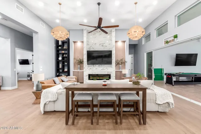 a spacious bedroom with a bed couch and a large window