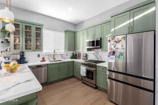 a view of tennis court with houses