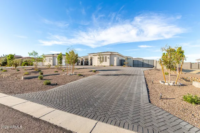 a living room with furniture a flat screen tv and a large window
