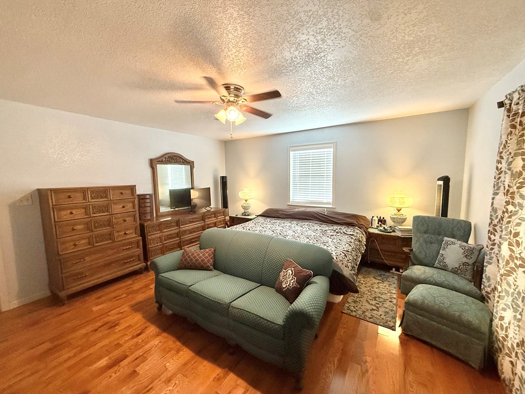281 Oak Road Harper, TX 78631 - Photo 12 of 22 a living room with furniture and wooden floor
