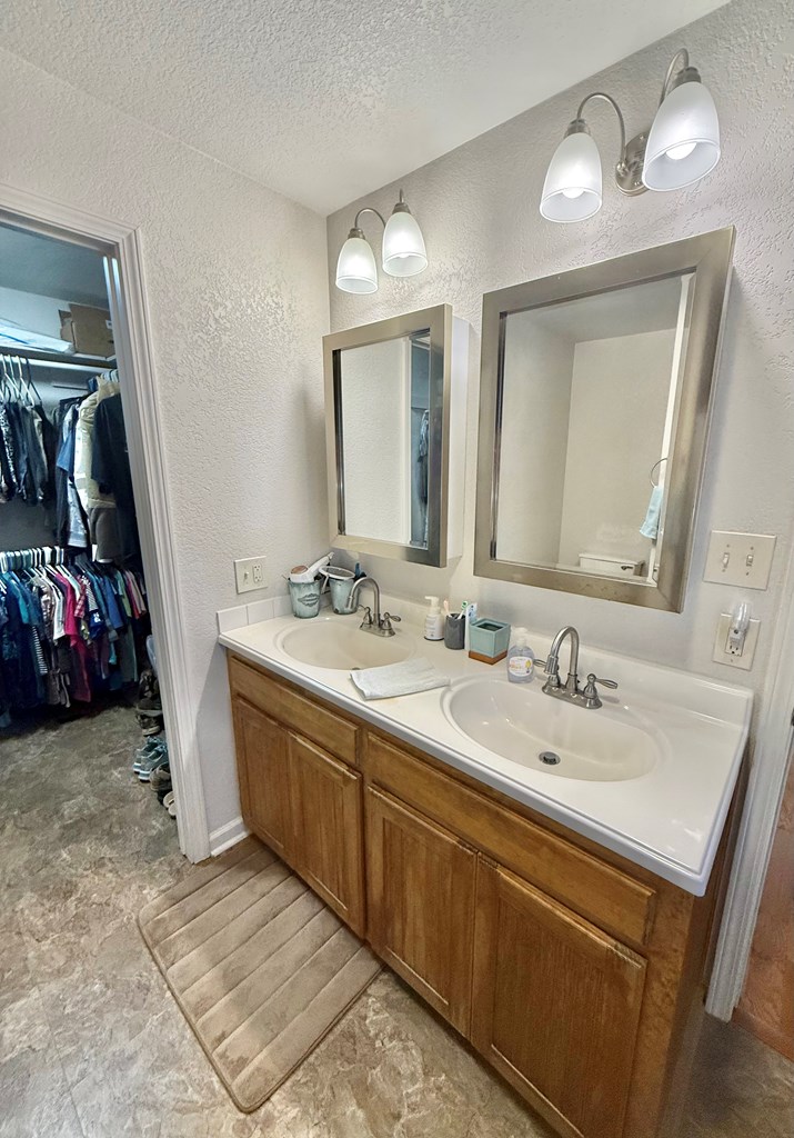 281 Oak Road Harper, TX 78631 - Photo 13 of 22 a bathroom with 2 sink and a mirror