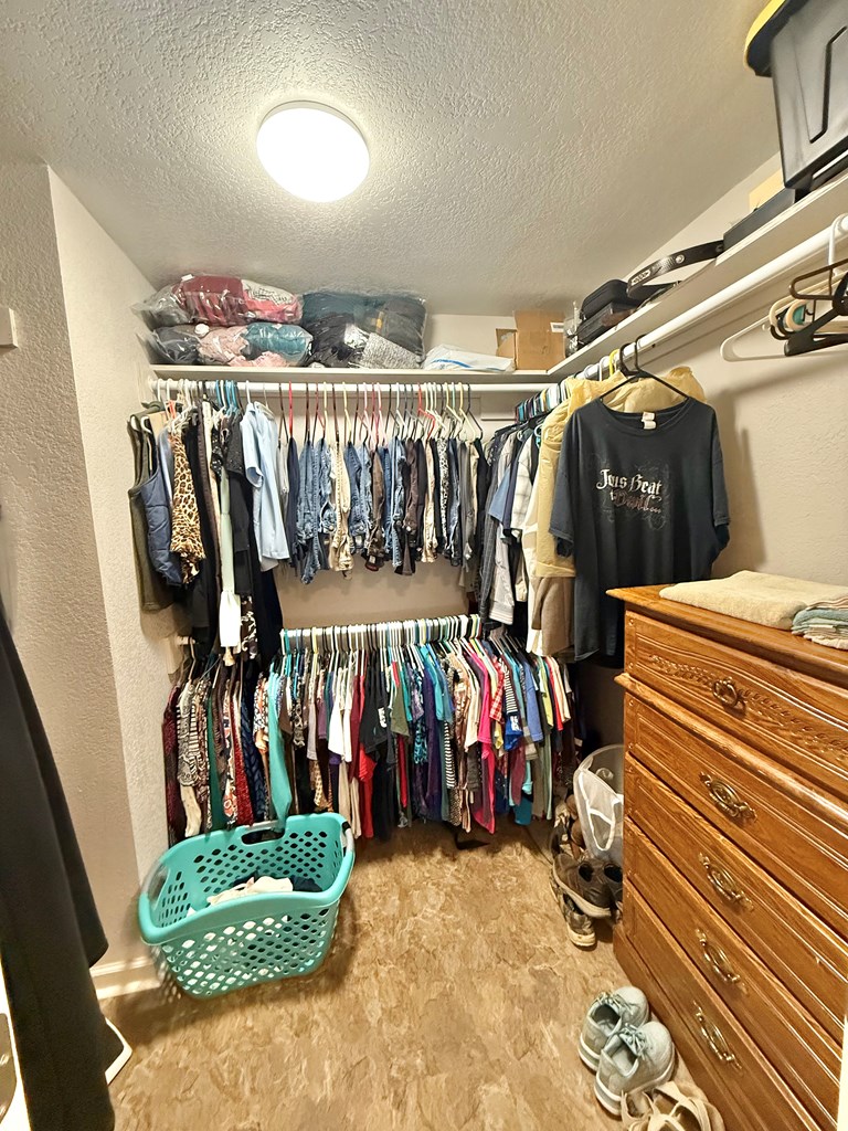 281 Oak Road Harper, TX 78631 - Photo 14 of 22 a view of walk in closet with clothes and shoes