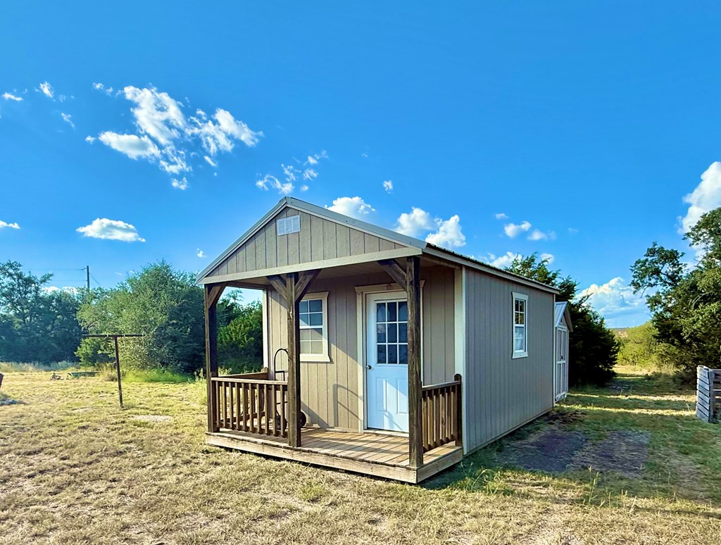 281 Oak Road Harper, TX 78631 - Photo 15 of 22 a front view of a house with garden