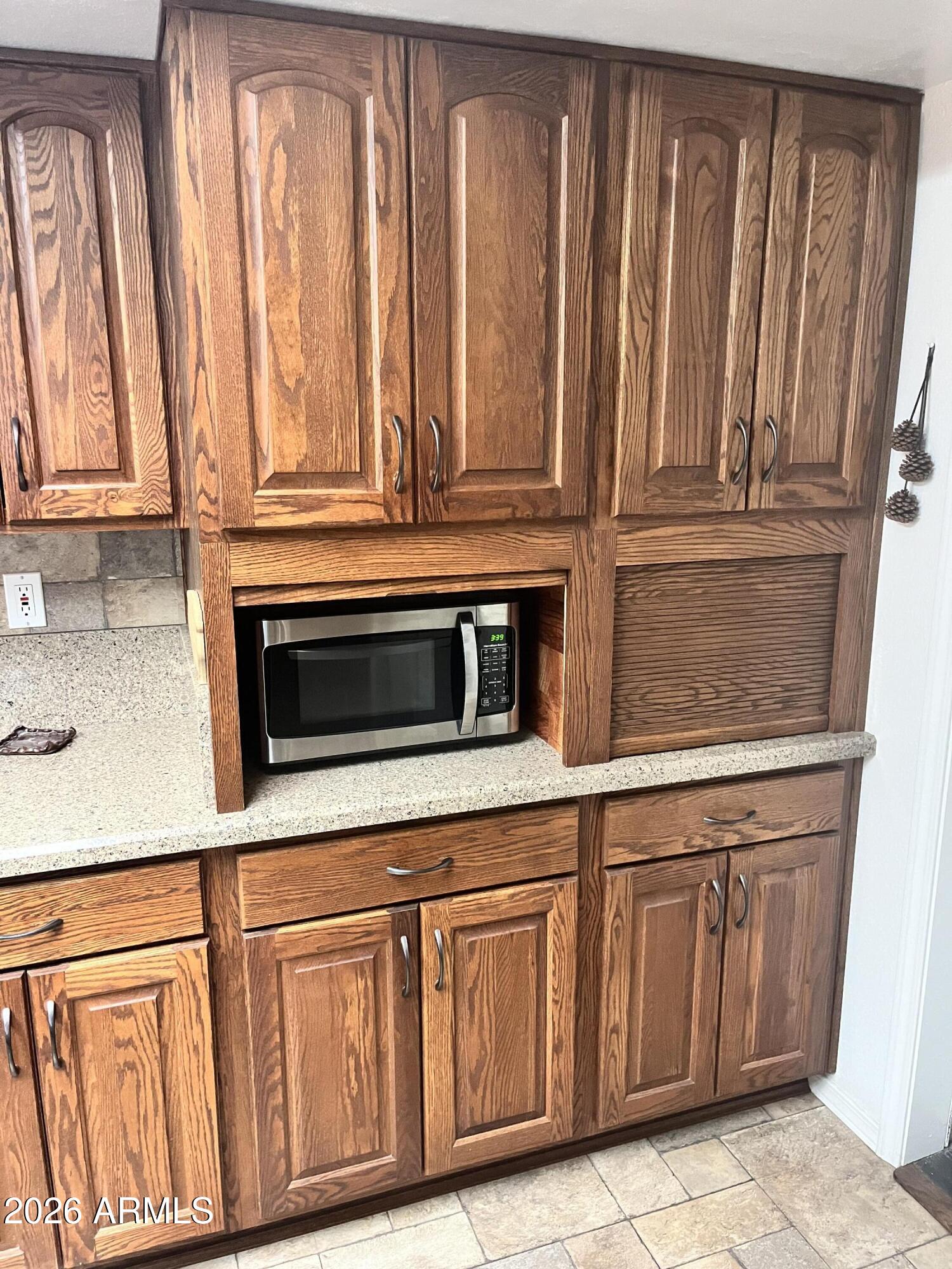 1006 North Matterhorn Road Payson, AZ 85541 - Photo 13 of 37 a kitchen with wooden cabinets and a sink