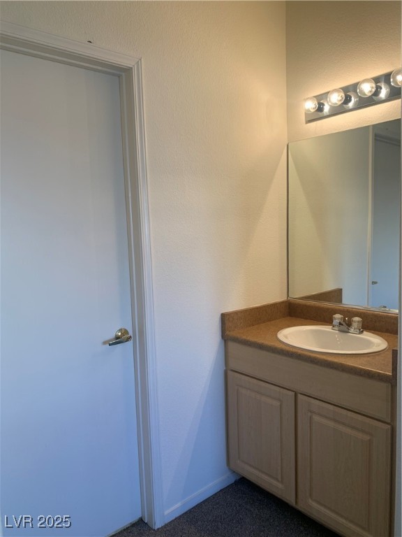 8250 North Grand Canyon Drive, Unit 1158 Las Vegas, NV 89166 - Photo 21 of 40 Bathroom with vanity and a textured wall
