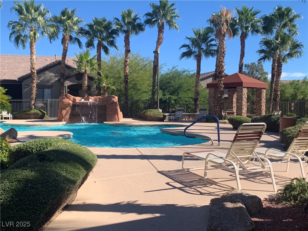 8250 North Grand Canyon Drive, Unit 1158 Las Vegas, NV 89166 - Photo 32 of 40 Community pool featuring a patio area