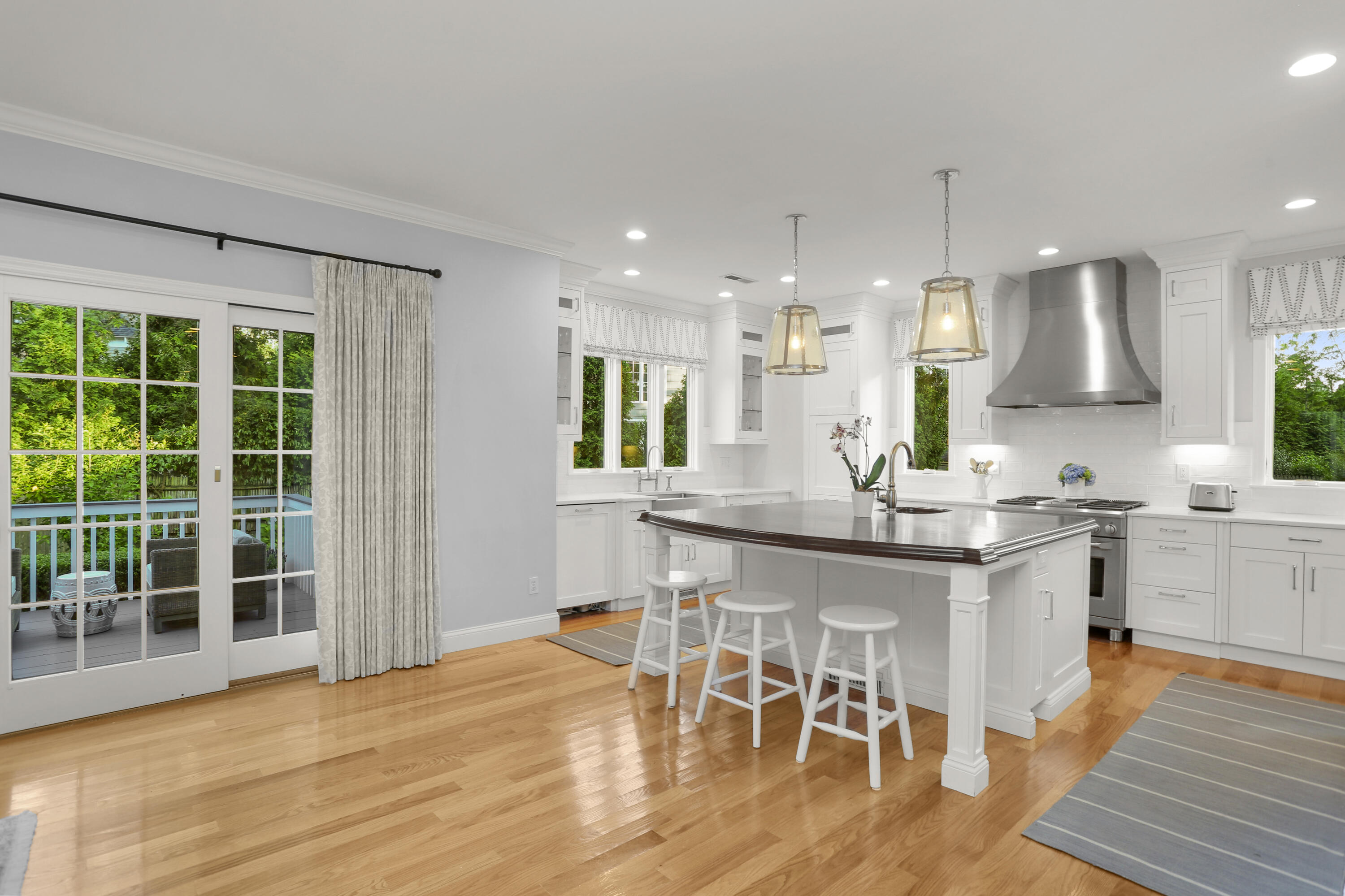 12 Richmond Road Norwalk, CT 06853 - Photo 14 of 40 a kitchen with stainless steel appliances granite countertop a kitchen island a stove a table and a sink