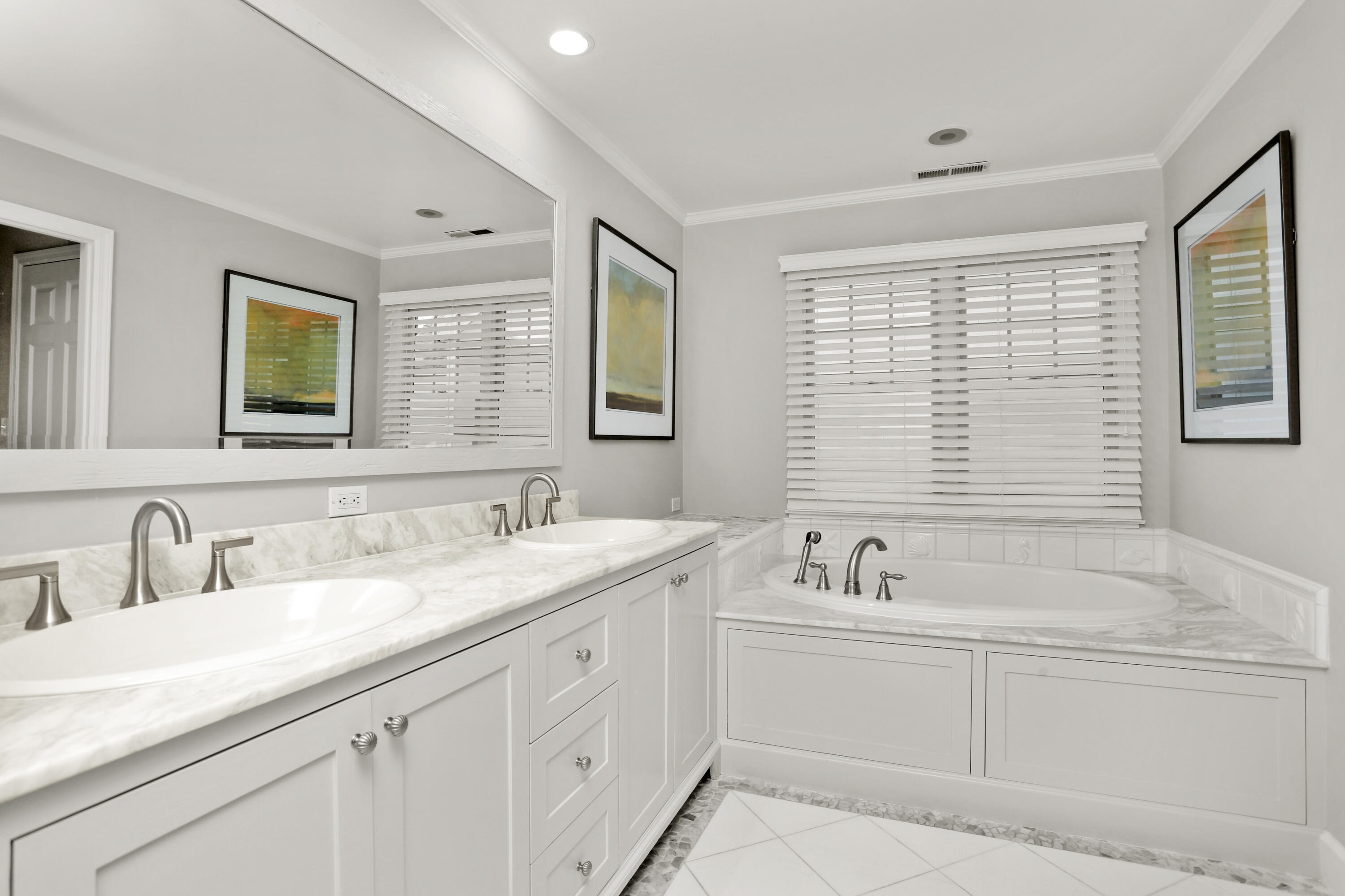 12 Richmond Road Norwalk, CT 06853 - Photo 21 of 40 a bathroom with a sink double vanity granite tub and a window