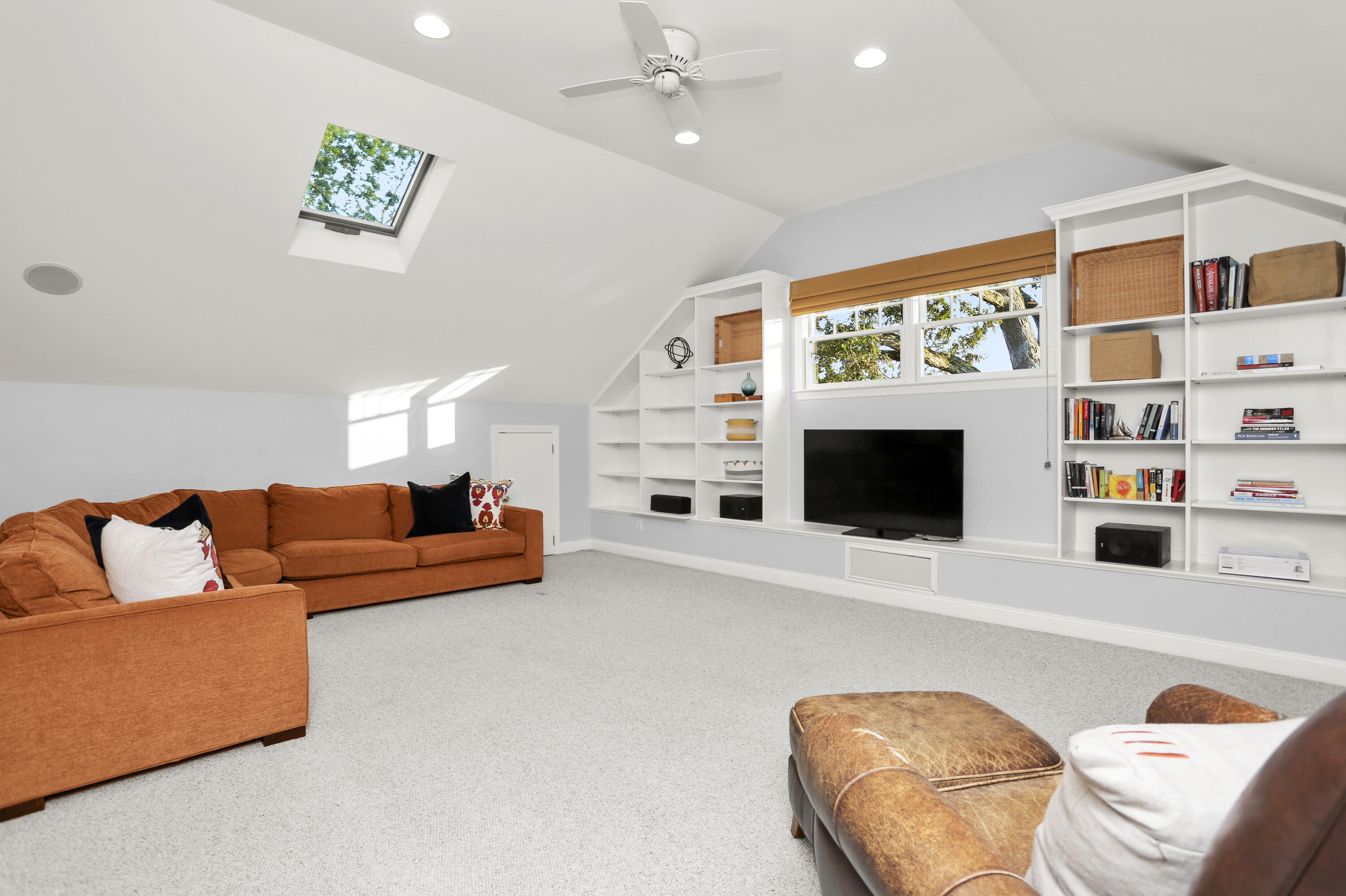 12 Richmond Road Norwalk, CT 06853 - Photo 29 of 40 a living room with furniture and a flat screen tv