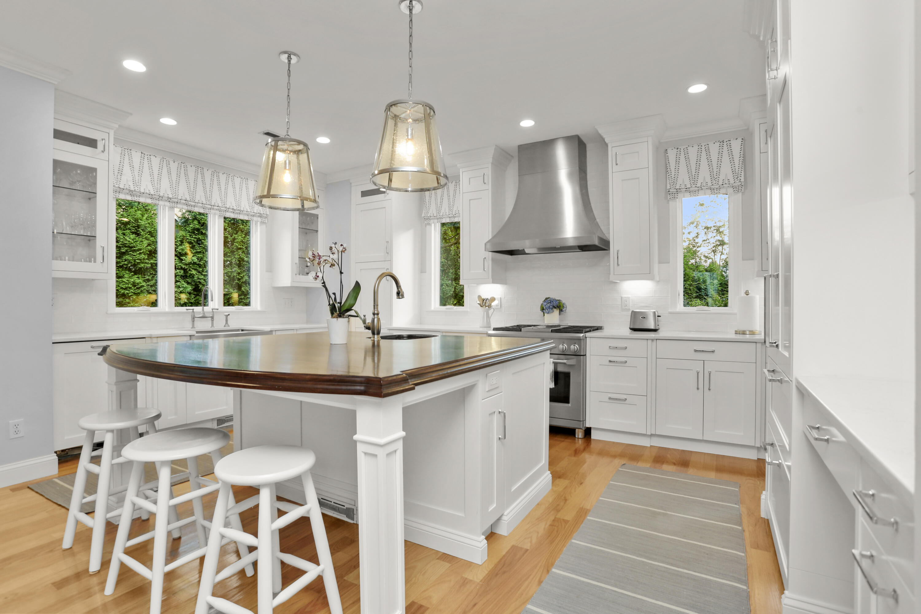 12 Richmond Road Norwalk, CT 06853 - Photo 10 of 40 a kitchen with stainless steel appliances granite countertop a sink a stove and a wooden floors