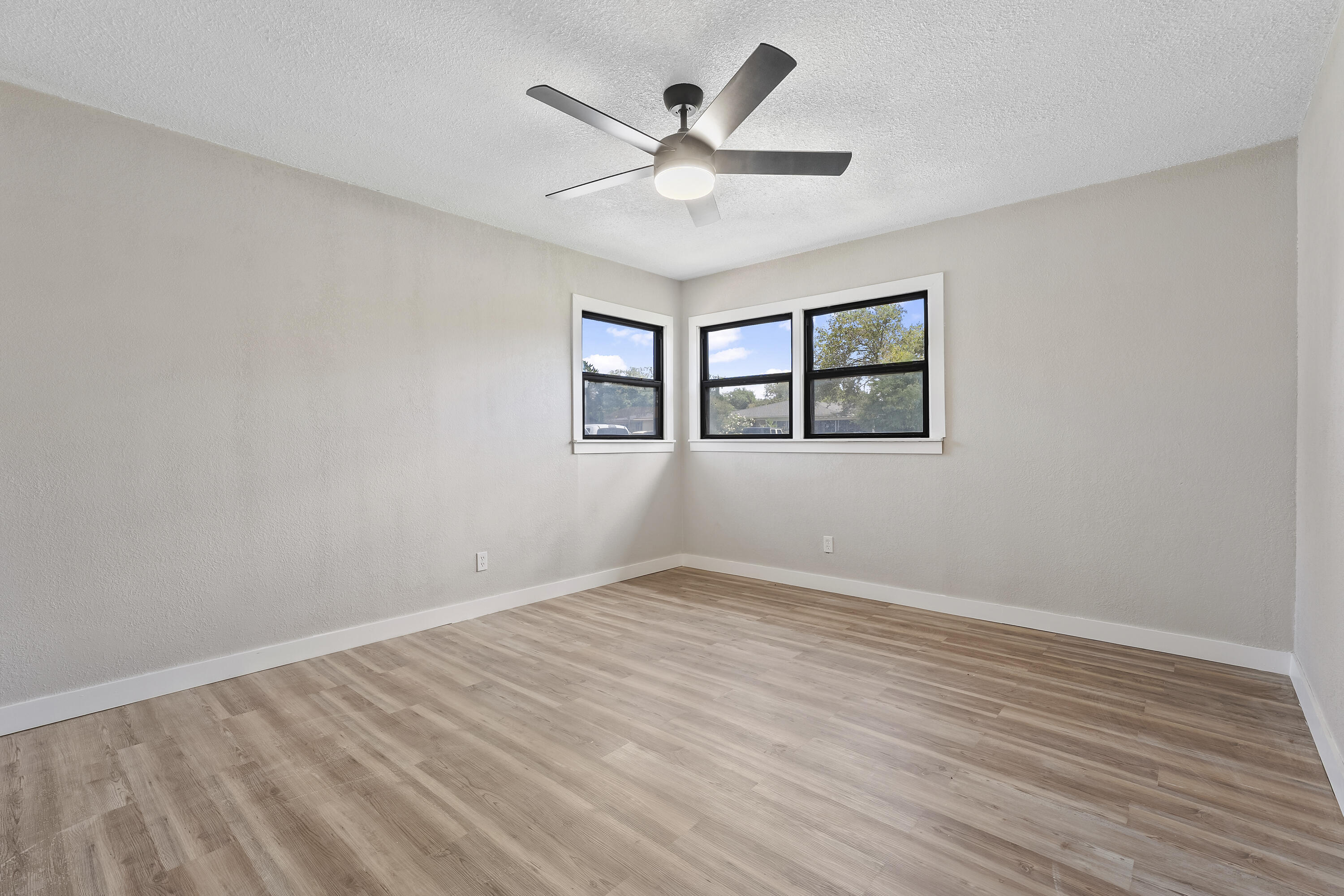4308 43rd Street Lubbock, TX 79413 - Photo 22 of 28 wooden floor in an empty room with a window