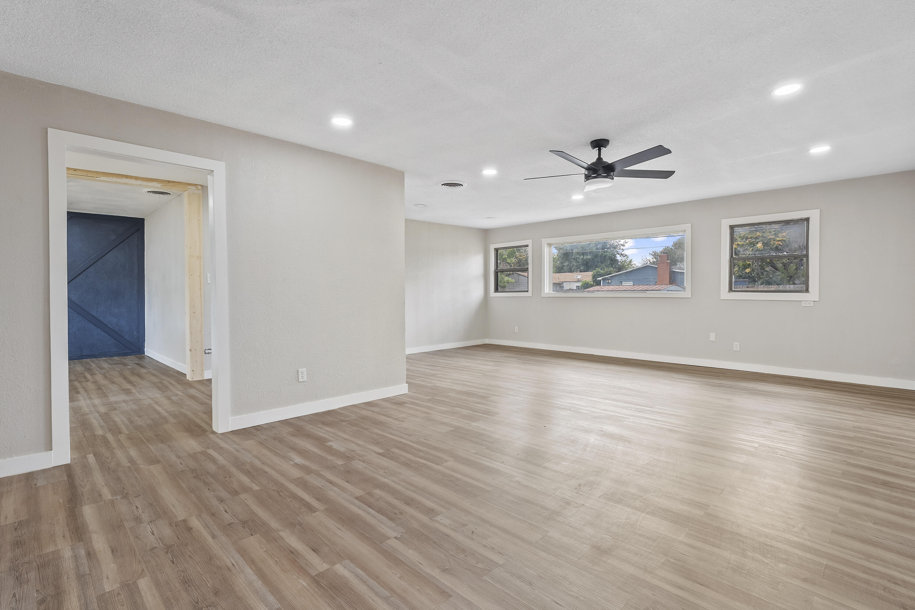 4308 43rd Street Lubbock, TX 79413 - Photo 6 of 28 a view of empty room with wooden floor and fan