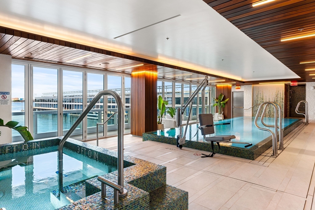 150 Seaport, Unit 9C Boston, MA 02210 - Photo 24 of 39 a view of a patio with table and chairs