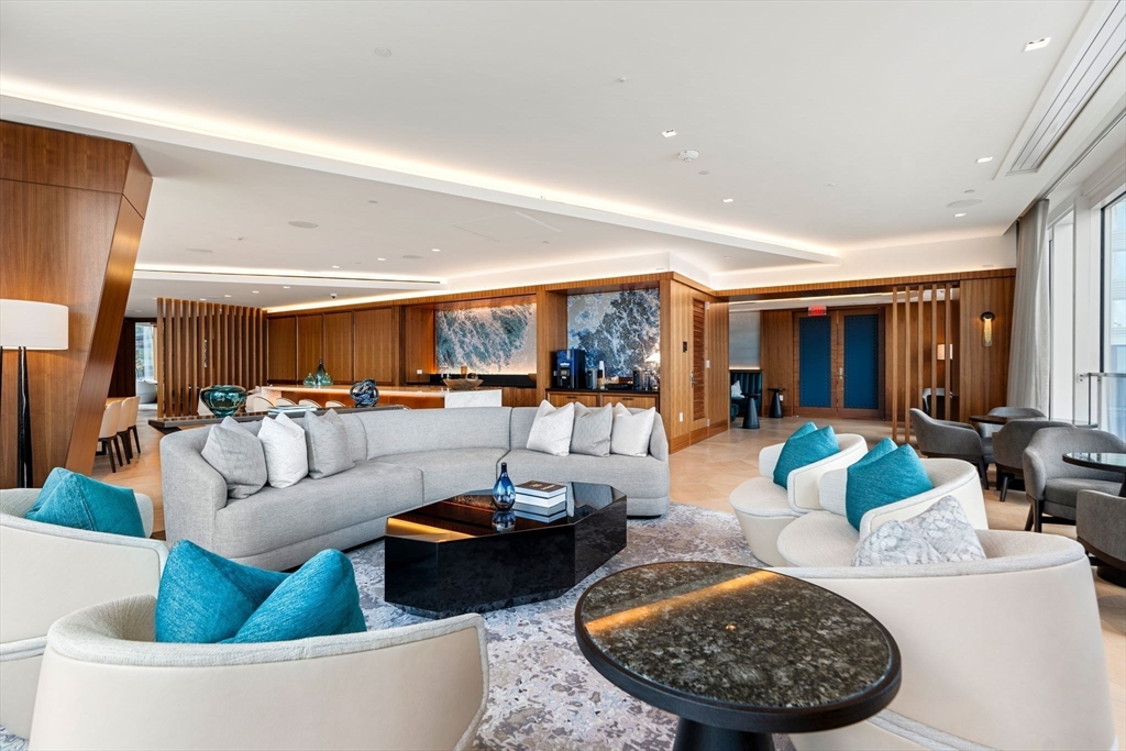 150 Seaport, Unit 9C Boston, MA 02210 - Photo 28 of 39 a living room with furniture and a large window