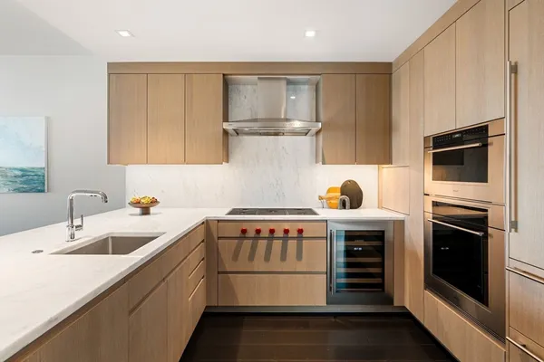 a kitchen with a sink cabinets and stainless steel appliances