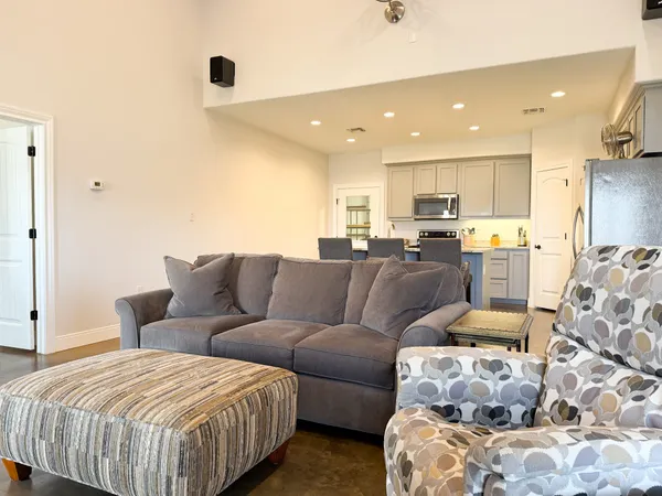a large bedroom with bed and furniture