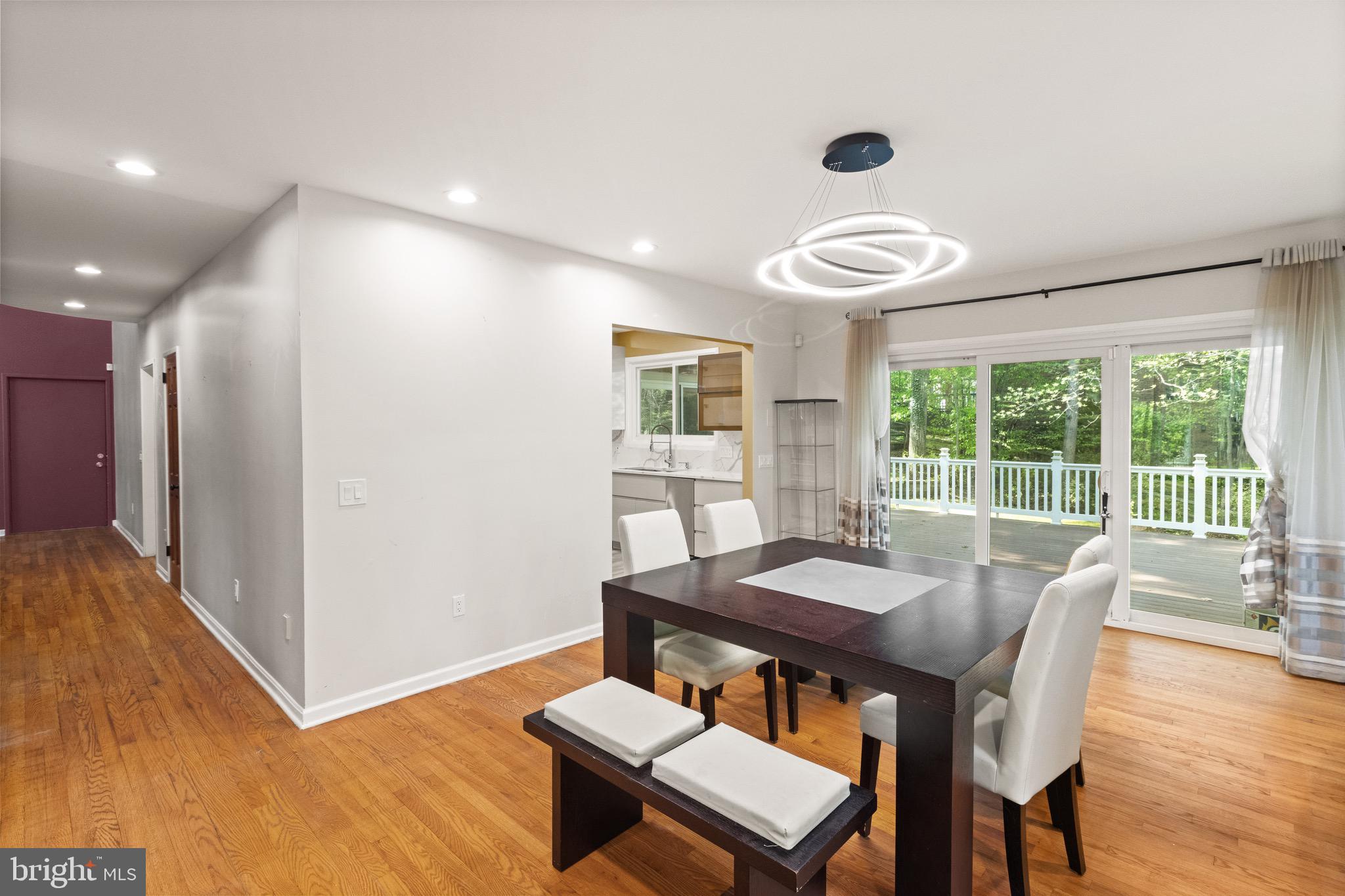 9220 Beech Hill Drive Bethesda, MD 20817 - Photo 11 of 50 a view of a dining room with furniture window and wooden floor